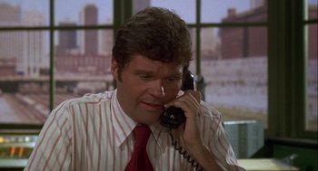 Movie still from “Silver Streak” (1976), directed by Arthur Hiller – A person talking on a phone; Close Up shot, High angle