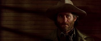 Movie still from “Silverado” (1985), directed by Lawrence Kasdan – A person wearing a hat; Close Up shot, Low angle