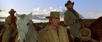 Movie still from “Silverado” (1985), directed by Lawrence Kasdan – A man wearing a hat and a jacket on a horse; Medium shot, Low angle
