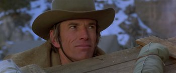 Movie still from “Silverado” (1985), directed by Lawrence Kasdan – A person wearing a hat and looking up; Close Up shot, Low angle