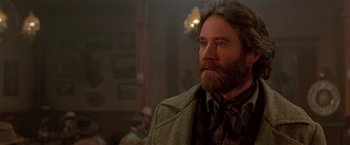 Movie still from “Silverado” (1985), directed by Lawrence Kasdan – A man with a long beard wearing a jacket; Close Up shot, Low angle