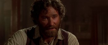 Movie still from “Silverado” (1985), directed by Lawrence Kasdan – A person with a beard; Close Up shot, Over the shoulder angle
