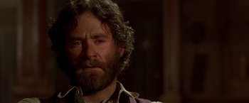 Movie still from “Silverado” (1985), directed by Lawrence Kasdan – A person with a beard; Close Up shot, Over the shoulder angle