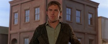 Movie still from “Silverado” (1985), directed by Lawrence Kasdan – A person wearing a shirt and a jacket; Close Up shot, Low angle