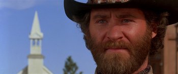 Movie still from “Silverado” (1985), directed by Lawrence Kasdan – A person wearing a hat; Close Up shot, Low angle