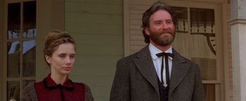 Movie still from “Silverado” (1985), directed by Lawrence Kasdan – A man and a woman standing next to each other; Close Up shot, Low angle