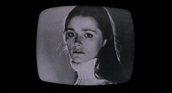Movie still from “Sisters” (1972), directed by Brian De Palma – A black and white photo of a young woman in a sweater; Close Up shot, Low angle