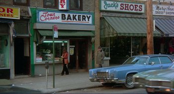 Movie still from “Sisters” (1972), directed by Brian De Palma – A man and a woman walking down the street; Wide shot, High angle