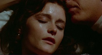 Movie still from “Sisters” (1972), directed by Brian De Palma – A person laying on their stomach; Extreme Close Up shot, Overhead angle