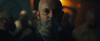 Movie still from “Skin” (2018), directed by Guy Nattiv – A bald man with a tattoo on his face; Close Up shot, Low angle