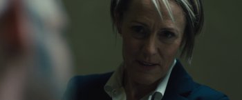 Movie still from “Skin” (2018), directed by Guy Nattiv – A person wearing a suit and tie; Close Up shot, Over the shoulder angle