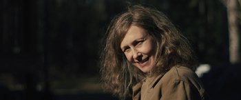 Movie still from “Skin” (2018), directed by Guy Nattiv – A person with long brown hair; Close Up shot, High angle