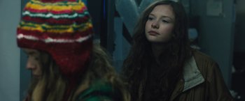 Movie still from “Skin” (2018), directed by Guy Nattiv – A young girl looking at herself in the mirror; Close Up shot, Over the shoulder angle