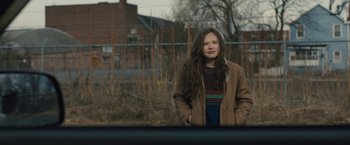 Movie still from “Skin” (2018), directed by Guy Nattiv – A woman standing in front of a wire fence; Medium shot, Over the shoulder angle