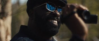 Movie still from “Skin” (2018), directed by Guy Nattiv – A person wearing sunglasses and a hat; Close Up shot, Low angle