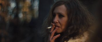Movie still from “Skin” (2018), directed by Guy Nattiv – A person holding a cigarette in her mouth; Close Up shot, High angle