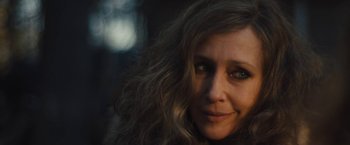 Movie still from “Skin” (2018), directed by Guy Nattiv – A person with long curly hair; Close Up shot, Over the shoulder angle