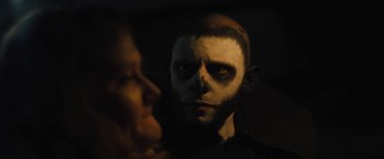 Movie still from “Skin” (2018), directed by Guy Nattiv – A man with a skull face painted on his face; Close Up shot, Over the shoulder angle