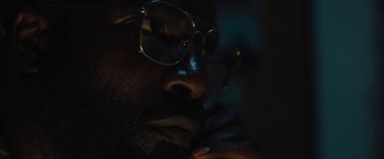 Movie still from “Skin” (2018), directed by Guy Nattiv – A person wearing glasses; Extreme Close Up shot, High angle