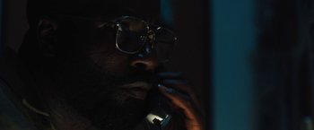 Movie still from “Skin” (2018), directed by Guy Nattiv – A person talking on a cell phone; Close Up shot, Low angle