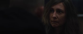 Movie still from “Skin” (2018), directed by Guy Nattiv – A person with long brown hair; Close Up shot, Over the shoulder angle