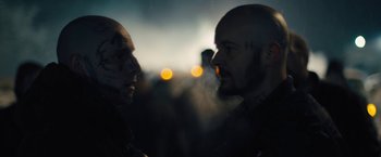 Movie still from “Skin” (2018), directed by Guy Nattiv – Two men face each other in a dark room; Close Up shot, Over the shoulder angle