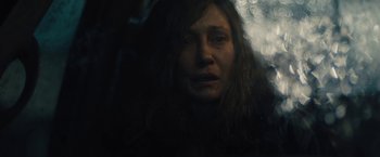 Movie still from “Skin” (2018), directed by Guy Nattiv – A person with her eyes closed; Close Up shot, Over the shoulder angle
