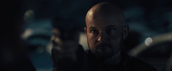 Movie still from “Skin” (2018), directed by Guy Nattiv – A man with a bald head is looking at the camera; Close Up shot, Over the shoulder angle