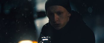 Movie still from “Skin” (2018), directed by Guy Nattiv – A man in a black jacket and a black hat; Close Up shot, Low angle