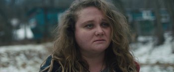 Movie still from “Skin” (2018), directed by Guy Nattiv – A person with curly hair; Close Up shot, Over the shoulder angle