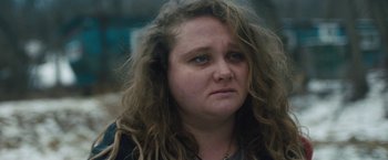 Movie still from “Skin” (2018), directed by Guy Nattiv – A person with curly hair; Close Up shot, Over the shoulder angle