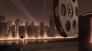 Movie still from “Sky Captain and the World of Tomorrow” (2004), directed by Kerry Conran – A man standing in front of a city with a movie projector; Extreme Wide shot, High angle