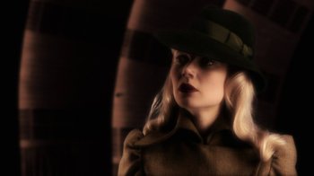 Movie still from “Sky Captain and the World of Tomorrow” (2004), directed by Kerry Conran – A woman wearing a green hat and a coat; Close Up shot, Low angle