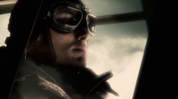 Movie still from “Sky Captain and the World of Tomorrow” (2004), directed by Kerry Conran – A person wearing goggles and a jacket; Close Up shot, Low angle