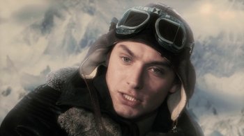 Movie still from “Sky Captain and the World of Tomorrow” (2004), directed by Kerry Conran – A person wearing a hat and goggles; Close Up shot, Low angle