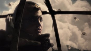 Movie still from “Sky Captain and the World of Tomorrow” (2004), directed by Kerry Conran – A woman in a pilot's hat looking out a window; Close Up shot, Low angle
