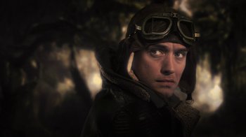 Movie still from “Sky Captain and the World of Tomorrow” (2004), directed by Kerry Conran – A person wearing a pilot's outfit; Close Up shot, Low angle