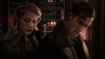 Movie still from “Sky Captain and the World of Tomorrow” (2004), directed by Kerry Conran – A man and a woman sitting next to each other; Close Up shot, Low angle