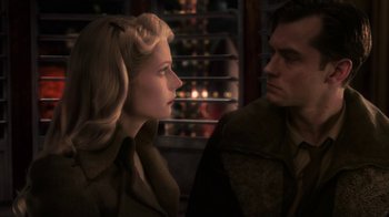 Movie still from “Sky Captain and the World of Tomorrow” (2004), directed by Kerry Conran – A man and a woman looking at one another; Close Up shot, Over the shoulder angle