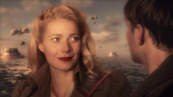 Movie still from “Sky Captain and the World of Tomorrow” (2004), directed by Kerry Conran – A man and a woman are looking at each other; Close Up shot, Over the shoulder angle