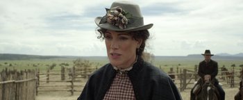 Movie still from “Godless” (2017), directed by Scott Frank – A person wearing a hat; Close Up shot, Over the shoulder angle