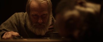 Movie still from “Godless” (2017), directed by Scott Frank – An old man with a beard looking at himself in the mirror; Close Up shot, Over the shoulder angle