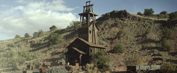 Movie still from “Godless” (2017), directed by Scott Frank – An old wooden building with a large tower on top of it; Extreme Wide shot, Low angle