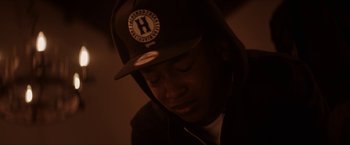 Movie still from “Sleight” (2016), directed by J.D. Dillard – A young man wearing a baseball cap and a jacket; Close Up shot, High angle