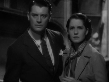 Movie still from “Smilin' Through” (1932), directed by Sidney Franklin – A black and white photo of a man and a woman; Close Up shot, Low angle