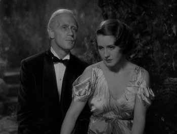 Movie still from “Smilin' Through” (1932), directed by Sidney Franklin – An old photo of a man and a woman; Close Up shot, High angle