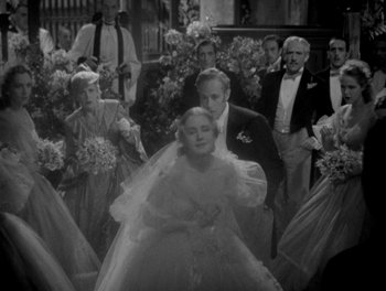 Movie still from “Smilin' Through” (1932), directed by Sidney Franklin – A black - and - white photo of a woman in a wedding dress; Wide shot, High angle