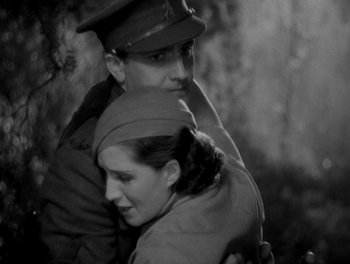 Movie still from “Smilin' Through” (1932), directed by Sidney Franklin – A man and a woman are hugging each other; Medium shot, High angle