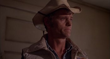 Movie still from “Smokey and the Bandit II” (1980), directed by Hal Needham – A man wearing a cowboy hat looking to his left; Close Up shot, Low angle