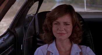 Movie still from “Smokey and the Bandit II” (1980), directed by Hal Needham – A person sitting in a car; Close Up shot, Over the shoulder angle